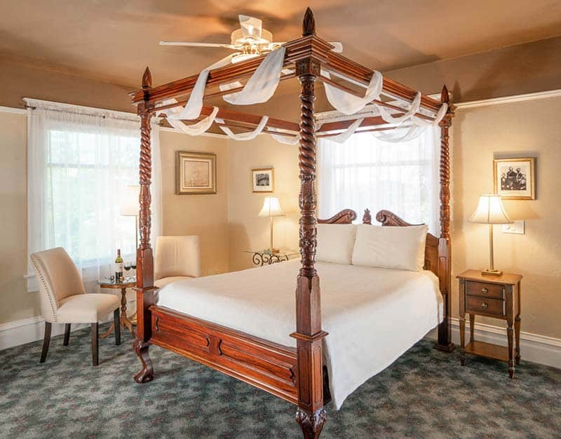 A classic four-poster bed awaits you at the best Albuquerque Bed and Breakfast for couples: Bottger Mansion!