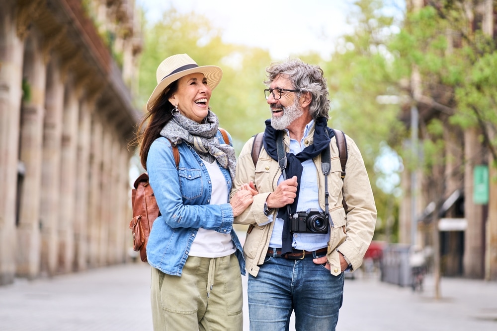 An older couple strolling through old town during their stay at Bottger Mansion: the best Albuquerque Bed and Breakfast for couples!