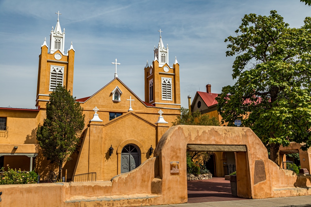 The San Miguel Chapel in Santa Fe, New Mexico, featuring its distinctive adobe architecture and two bell towers.