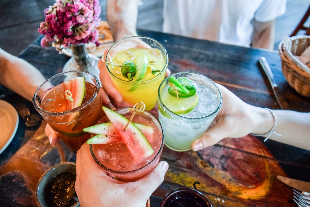 Friends sharing different margaritas at the top Albuquerque restaurants and restaurants in Old Town Albuquerque